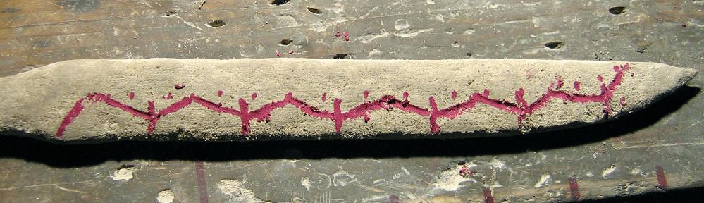 Blade with clay applied in preparation for hardening